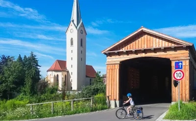 Child in front of bridge